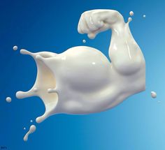 milk splashing into the air with blue sky in the backgroung background