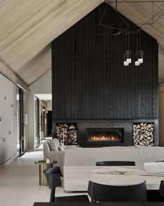 a living room with a fire place in the center