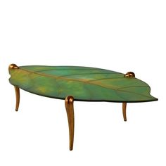 a green and gold leaf shaped coffee table