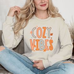 Looking for a cute versatile top to wear this summer? Make sure to grab one of our Cursive Fall Leaf Sweatshirts! This soft and comfortable shirt is the perfect top for any outfit. It can be paired with biker shorts, Jeans, or the classic stay at home sweats! The bright color adds a pop of summer to any outfit. This sweatshirt is true-to-size, so be sure to order your regular size! If you are looking for a more oversized look, make sure to size up. Cozy Cotton Leisure Tops, Cozy Fit Comfortable Cotton Tops, Comfortable Cozy Fit Cotton Top, Comfortable Cotton Tops With Cozy Fit, Cozy Letter Print Tops For Spring, Trendy Crew Neck Leisure Tops, Trendy Crew Neck Tops For Leisure, Cotton Graphic Print Tops For Lounging, Cute Cotton Tops For Lounging