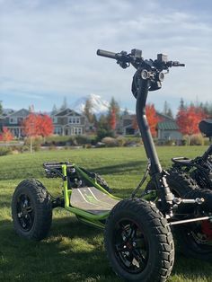 an electric scooter is parked in the grass