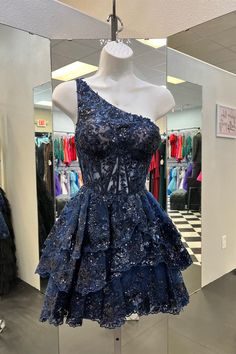 The princess navy blue short A-line homecoming dress features a one-shoulder neck, a corset bodice, a ruffled skirt, and a zip-up back. SKU: 3240 Tulle material One shoulder Bodycon silhouette Ruffles skirt Zip-up back Ship in 7-10 business days Size: US 2-16. We offer free returns in 7 days. Please refer to our return policy page for more details. If you have any questions, don't hesitate to contact us: at service@dressesforparty.com. Midnight Blue Prom Dress Short, Navy Blue Lace Prom Dress, One Shoulder Homecoming Dress, Strapless Homecoming Dresses, Formal Ideas, Dresses Hoco, Winter Ball, Sequin Homecoming Dress, Ruffle Prom Dress