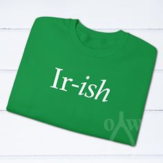 "Ir-ish funny St. Patrick's Day unisex Gildan crewneck sweatshirt DESIGN DETAILS -This listing is for one Irish Green unisex Gildan soft style short sleeve t-shirt with \"Ir-ish\" printed on the front in white using DTG (direct to garment) printing ORDERING -Your shirt is made to order, meaning we print it special just for you when your order is placed -Production typically takes anywhere from 1-3 business days depending on the availability of the item, and shipping will take an additional 2-5 b Crewneck Sweatshirt Design, St. Patrick’s Day, Green Sweatshirt, Saint Patrick, Green Shirt, Fabric Softener, Sweatshirt Designs, Soft Style, Design Details