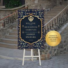 a welcome sign is standing in front of some stairs