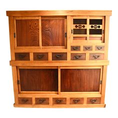 a wooden cabinet with many drawers on it