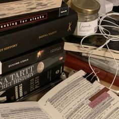 a pile of books sitting on top of a table