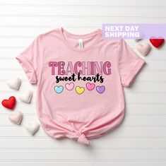 Valentines Day Teacher Shirt, Teaching Sweethearts Teacher Shirts, Teacher Valentines Day Gift, Love Teacher Shirt, Valentines Day T-Shirt Show your appreciation for teachers with our Valentine's Day Teacher Shirt! This "Teaching Sweethearts" tee makes a perfect gift for educators, featuring a charming design that celebrates their love for teaching. Ideal for spreading joy on Valentine's Day, it's a sweet addition to any teacher's wardrobe! Welcome to LunaTeeApparel ☺️ Our shirts are clean, high quality and soft. It is prepared quickly by our boutique Ironing and shipped. Enjoy your shopping It is a pleasure for us to help you with your questions and you can reach us at any time. Please, don't forget to check our size cards. HOW TO ORDER SHIRT 👕 Please, choose your favorite t-shirt color Valentines Day Teacher, Teacher Valentines, Teacher Wardrobe, Love Teacher, Text Shirt, Gift Love, Raleigh Nc, Teacher Shirts, Shirt Color