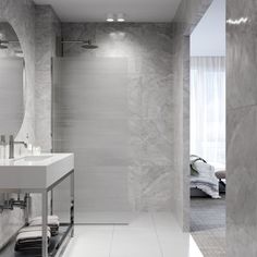 a modern bathroom with marble walls and floor