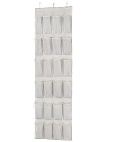 an over the door hanging organizer in white with multiple pockets and hooks on each side