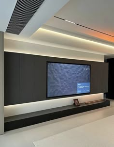 a large flat screen tv mounted to the side of a wall