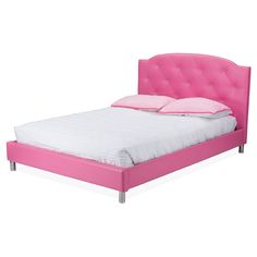 a bed with pink headboard and foot board on top of white sheeted sheets