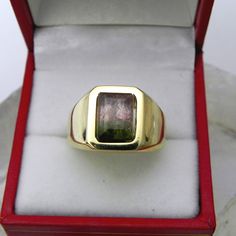 This is as fine and elegant a man's ring as you will ever find. The perfect blend of a fine gemstone matched up with a simple Clean Design that will appeal to any man. A timeless design that will always be tasteful without being too bold. A statement piece. Good solid weight, nicely distributed to give the ring an even weight, so it will lay on your finger comfortable without too much play. There is nothing worse than a top heavy ring that constantly spins, or flip flops back and forth. A good w Mans Ring, Watermelon Tourmaline, Clean Design, Emerald Cut, Statement Pieces, Tourmaline, Timeless Design, Watermelon, Flip Flops