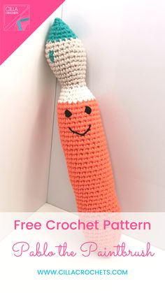 a crocheted carrot hanging on the wall with text overlay that reads free crochet pattern palo the paintbrush