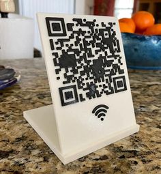 a qr - code is displayed on top of a tabletop in a kitchen