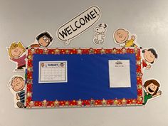 a bulletin board with stickers on it that says welcome