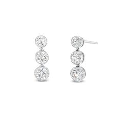 Turn up the sparkle on your style with these lab-created diamond three-stone drop earrings. 14K white gold Each linear drop features a trio of round certified lab-created diamonds graduating in size to the largest 1/4 ct. stone at the base F color/SI2 clarity Includes certification card 1 ct. t.w. of lab-created diamonds Friction backs Three-stone Diamond Earrings For Anniversary, Three Stone Earrings In Fine Jewelry Style, Three Stone Fine Jewelry Earrings, Anniversary Three-stone Diamond White Earrings, Diamond White Three Stone Earrings For Anniversary, Classic Three Stone Diamond Earrings For Formal Events, Classic Three Stone Diamond Earrings, Classic Three Stone White Gold Earrings, Classic Three Stone Diamond Earrings For Anniversary