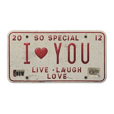 an old license plate with the words i love you written in red and white on it