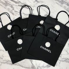 Bundle Of 7 Authentic Chanel Large Size Black Paper Gift Or Shopping Tote Bags With Camellia Flower Stickers Length: 17” Height: 13” Width: 6” Chanel Gift Bags, Shopping Tote Bags, Chanel Black And White, Flower Stickers, Camellia Flower, Chanel Bags, Black Paper, Shopping Tote Bag, Shopping Tote