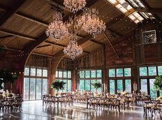 a large banquet hall with chandeliers and tables