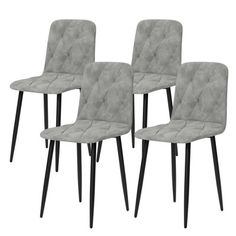 four grey velvet dining chairs with black legs