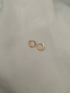 Brand new  *These are for a pair of mini hoops that may be able to fit for seconds and thirds too! They are very small and ear pin needs to be pushed down to click into place when you put them in! COLOURGold SIZE0.9x0.95cm 0.7cm inner Diameter MaterialGold Stainless Steel  Weight4 g Perfect for sensitive ears! Water friendly and tarnish resistant 💌Price includes free untracked shipping within Australia Tiny Gold Minimalist Huggie Earrings, Gold Huggie Cartilage Earrings For Everyday, Gold Round Everyday Cartilage Earrings, Everyday Gold Huggie Cartilage Earrings, Gold Round Cartilage Earrings For Everyday, Tiny Gold Huggie Cartilage Earrings, Simple Gold Cartilage Earrings For Everyday, Tiny 14k Gold Hoop Earrings For Everyday, Tiny Yellow Gold Huggie Hoop Earrings