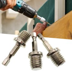 a person using a drill to fix screws on a piece of wood and metal