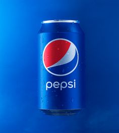 a can of pepsi on a blue background