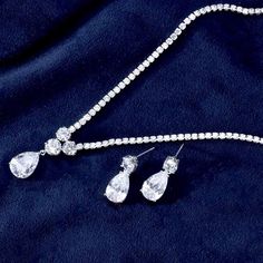 A beautiful two-piece bridal jewelry set with an incredible sparkle! Adorned with intricately faceted cubic zirconia that capture the light from every angle with a perfectly translucent appeal, the pieces are platinum plated for a flawless finish which enhances the intricate detailing and conveys a modern take on old elegance. Necklace: 41cm (approx. 16") long with a secure fold-over closure Earrings: 22mm (approx. 7/8") long and come with sturdy backs Available in Silver and Gold finishes. To c Brilliant Cut Cubic Zirconia Jewelry Sets For Anniversary, Brilliant Cut Crystal Jewelry Sets For Anniversary, Elegant Silver Jewelry Sets With Diamond Cut, Anniversary Jewelry Sets With Brilliant Cut Crystals, Dazzling Silver Jewelry Set With Sparkling Stones, Classic Cubic Zirconia Jewelry Sets For Anniversary, Classic Silver Cubic Zirconia Jewelry Sets, Elegant Diamond White Crystal Jewelry Sets, Elegant Cubic Zirconia Jewelry Set In Diamond White