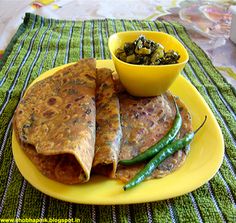 some food is on a yellow plate with a bowl of green beans and a cup