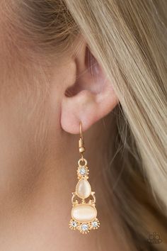 A glowing teardrop and oval moonstone is pressed into an ornate gold frame. Glassy white rhinestones adorn the top and bottom of the lure for a glamorous finish. Earring attaches to a standard fishhook fitting. Sold as one individual pair of earrings P5WH-GDXX-065XX Paparazzi Fashion, Pink Dragon, The Lure, White Moonstone, Paparazzi Accessories, White Rhinestone, Gold Rhinestone, Affordable Jewelry, Paparazzi Jewelry