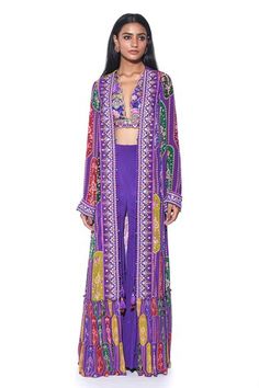 Violet self paisley print, tiered long shrug with hand embroidered border. Paired with a  purple embroidered scallop blouse and crimson tiered sharara. - Aza Fashions Bohemian Long Sleeve Sharara With Pallu, Bohemian Purple Sets With Zari Work, Bohemian Purple Sets With Dupatta, Bohemian Purple Set With Dupatta, Long Shrug, Scalloped Blouse, Embroidered Border, Sharara Set, Set For Women