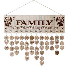 a wooden sign with hearts hanging from it