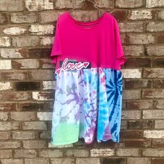 This Upcycled Tie dyed Boho Summer Dress/Tunic Festival Wear piece will be your favorite all Summer long. Classic Hippie Wear at its best.  *All measurements taken laying flat- Width-(underarm to underarm) 23in with stretch Length-(shoulder to hem) 35in Approx. Size- 16-17in=S/ 18-20in=M/ 21-22in=L/ 23-24in=XL/ 26in=XXL(2x)/ 29in=XXXL(3X) *In some cases I am able to add length or shorten so please feel free to ask. It may also be possible to add a pocket.  Vickie Love Altered Studio Casual Hand Dyed Cotton Dress, Boho Summer Dress, Boho Summer Dresses, Tie And Dye, Dress Tunic, Womens Tunics, Tie Dyed, Festival Wear, Tunic Dress