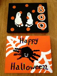 two halloween cards on a wooden table with black and orange background, one has an image of a spider and the other says boo boo