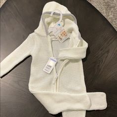 Brand New Sweater Outfit, Super Soft Winter Knitted Long Sleeve Onesie, Long Sleeve Onesie For Winter Playtime, Long Sleeve Onesie For Playtime In Winter, White Cotton Winter Onesie, Fitted Winter Onesie For Playtime, Winter Onesie For Playtime, White Fitted Winter Onesie, Cozy Hooded White Onesie, Cozy White Hooded Onesie