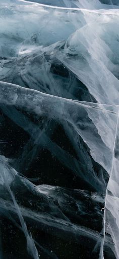 an airplane is flying through the air covered in ice