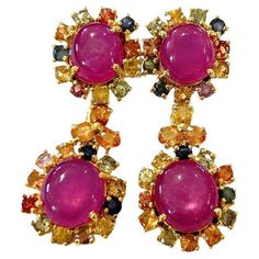 Bochic "Orient” Ruby & Multi Sapphire Earrings Set In 18K Gold & Silver Natural Ruby Oval Shapes - 17 Carats Multi Color Sapphires from Sri Lanka - 4.50 Carat Colors : Pink, Blue, Green, Yellow, Orange The earrings from the "Orient" traveling collection are the epitome of elegance and versatility. They offer a perfect blend of day to night and swimwear to evening wear, allowing you to effortlessly transition between different occasions and outfits. Wearing these spectacular drop oriental-style earrings will undoubtedly make you the center of attention. They add a touch of glamour and sophistication to your favorite caftans, swimwear, or evening attire, enhancing your overall look. The "Orient" collection, from which these earrings originate, showcases exceptional craftsmanship and incorpor Multi Sapphire, Sapphire Earrings, Style Earrings, Natural Ruby, Evening Attire, Natural Pearls, Yellow Orange, Earrings Set, Green Yellow