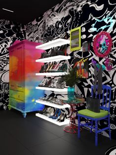 a room filled with lots of colorful furniture and wallpaper covered in black and white designs