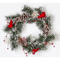 a christmas wreath with pine cones and poinsettis