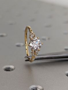 a diamond ring sitting on top of a table