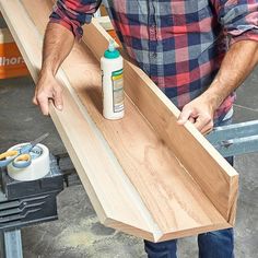 a man is working on some wood