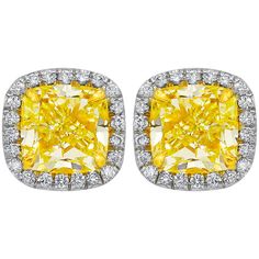 18K White gold fancy yellow diamond stud earrings with two GIA Certified Cushion Cut Diamonds. - Center diamonds totaling 2.10 Carats Fancy Light Yellow Cushion Cut Diamonds, SI in Clarity - GIA#1192256937 ; 1192264192 - Diamonds around totaling 0.40 carats. Canary Yellow Diamonds, Yellow Diamond Earring, Yellow Cushion, White Gold Diamond Earrings, Gold Diamond Earrings Studs, Gold Diamond Studs, White Gold Earrings Studs, White Gold Studs, Fancy Yellow Diamond