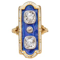 A small, delicate and beautifully handcrafted ring made in France during the Belle Epoque era, circa 1900. The design is inspired by late 18th century French ring types known as ‘firmament’ and ‘enfantement’ rings. They were designed by French jewellers to celebrate the long-awaited news that King Louis XVI and Marie Antoinette were expecting an heir (bagues au firmament), and the subsequent birth of the Dauphin of France (bagues à l’enfantement). The celestial cobalt blue guilloché enamel bezel contrasts beautifully with the bright white sparkle of the diamonds to mimic the night sky. The two striking Old Mine Cut diamonds are set in platinum and weigh approximately 0.5ct each. In the middle is a much smaller Old European Cut diamond weighing approx 0.025ct. The bezel is bordered by decor Ring Types, Bagan, Enamel Ring, Handcrafted Rings, European Cut Diamonds, Louis Xvi, Marie Antoinette, Belle Epoque, Types Of Rings