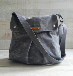 "Combo Messenger in Gray | Special waxed canvas wears like leather Waxed Combo Messenger Bag in Gray makes it easy to take your laptop, files, homework, clothing, and anything else you can stuff into it. Many people use waxed combo messenger bags as their personal carry-on bag for flights to store some extra travel stuff. Highly recommended for ease of use and genuine style, Measurements:( The size can be adjusted, please ask me ) ~14\"across the opening (35 cm), x ~ H 11.5\" (29 cm),x D ~4 \" ( Sailor Bags, Multi Pocket Bag, Waxed Canvas Backpack, Brown Leather Backpack, Canvas Messenger Bag, Waxed Canvas, Day Bag, Large Bag, Messenger Bags