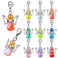 six different colors of butterfly charms on a white background with clippings for each charm