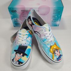 two shoes with anime characters painted on them next to a box for the shoe laces