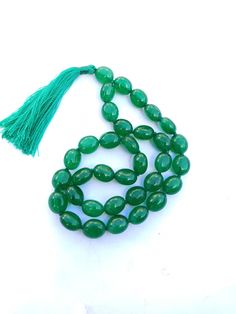 33+1 Beads AAA Emerald Beryl Hand Japa Mala Prayer Beads Green Color Tumble Beads Japa Mala Guru bead Hand Japa Mala // Long Tassel // Meditation japa mala // Guru bead// Yoga Beads Stone - Emerald Beryl Shape - Oval Size - Approx. - 10x12 mm Weight - 211 Carat 27+1 Beads Size - Approx. - 10x12 mm Weight - 255 Carat 33+1 Beads Quality AAA Color - Green It is known as the 'love stone' as the message it emits is the strong vibration of unconditional love, joy, warmth and healing. As quartz crystal Green Polished Beads Mala As Gift, Green Polished Beads Mala For Gift, Large Oval Spiritual Beads, Gift Green Polished Beads Mala, Green Mala With Polished Beads As Gift, Green Gemstone Beads Mala, Green Large Spiritual Beads, Green Hand-strung Mala With Round Beads, Green Hand-strung Mala