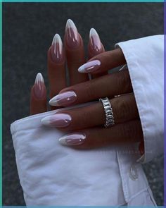 a woman's hand with pink and white acrylic nails