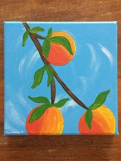 an acrylic painting of two oranges on a branch