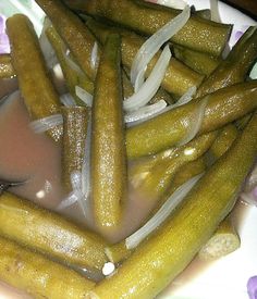 a plate with pickles and onions on it